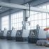 CNC torna tezgâhı sırasının üzerinde tutuculu gantry kartezyen robot ve yanında turuncu altı eksenli robot kol
